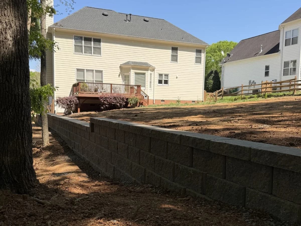 Urban wall and grading project creating a usable upper yard